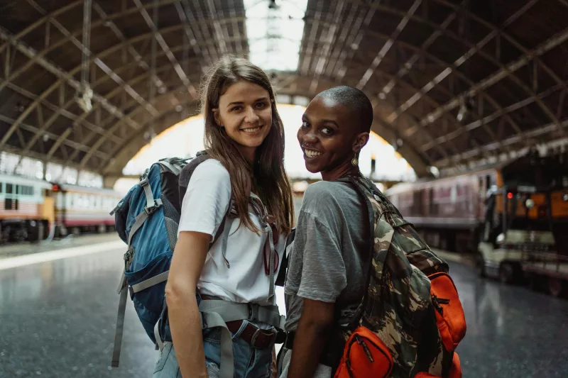 Two people one looking back, one looking forward